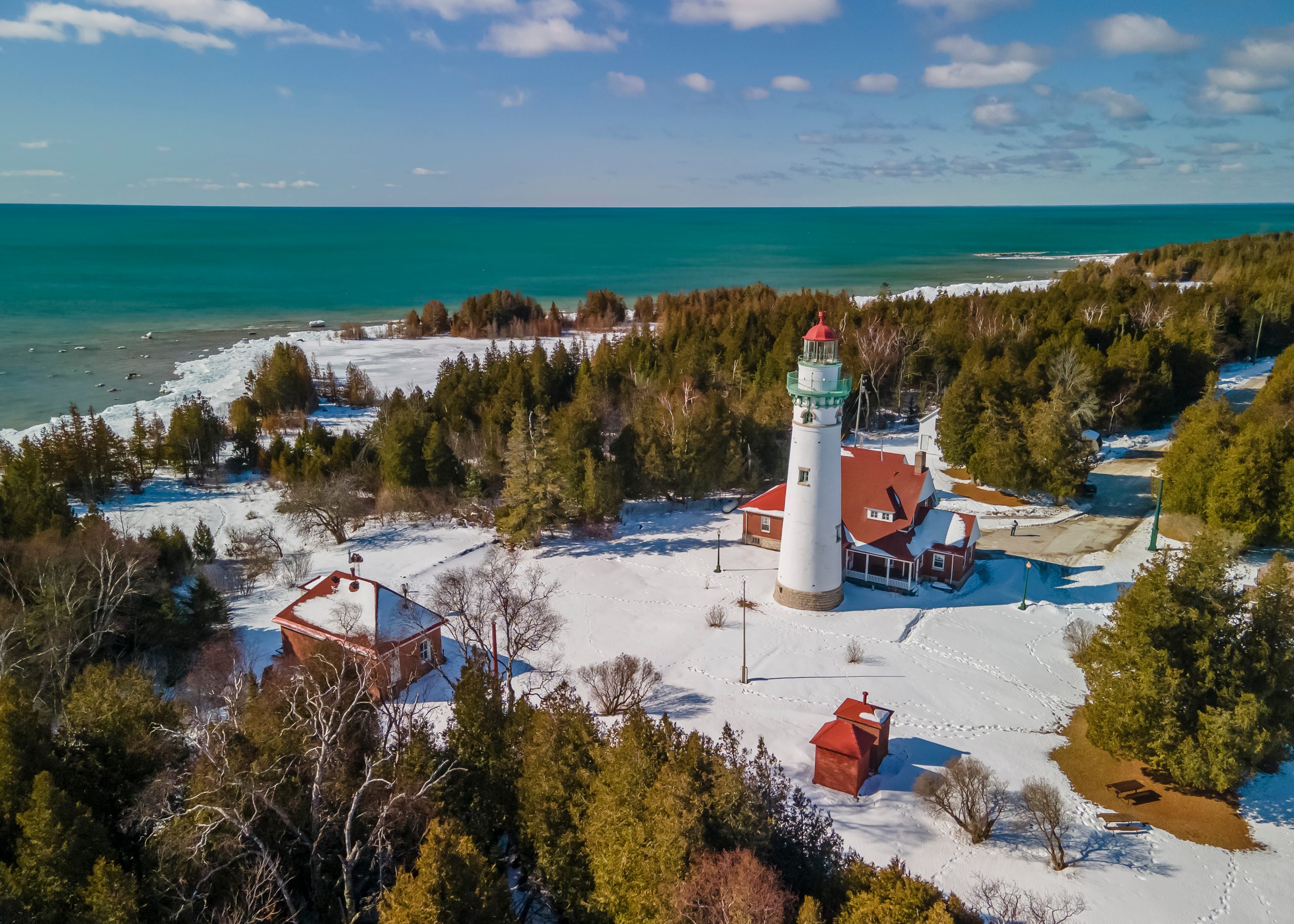 Aerial view of Seul Choix Pointe in Michigan upper peninsula with historic light house in the middle